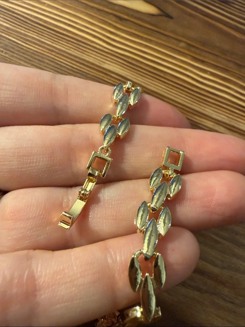 Gold-Tone Bracelet with Red Gem Leaf Accents